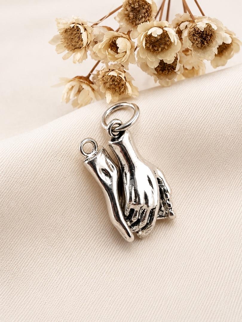 Dije de Plata Pareja