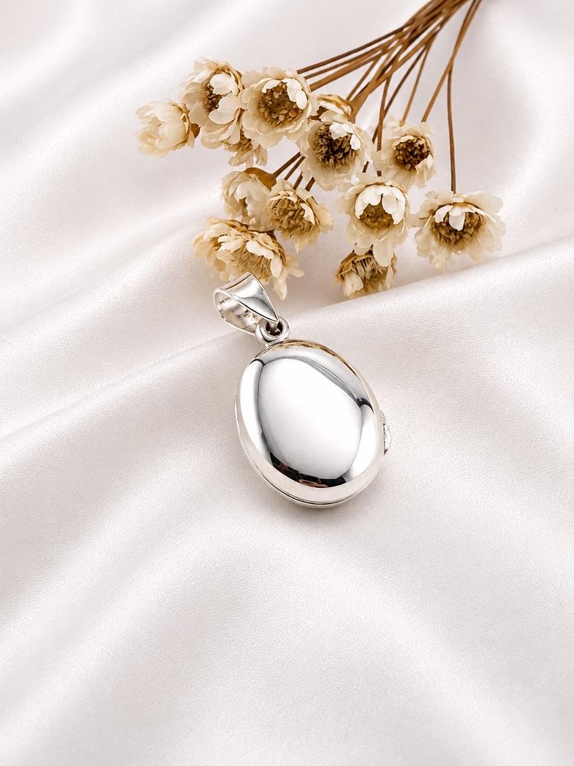 DIJE DE PLATA RELICARIO
