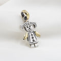 DIJE NIÑA DE PLATA CON LÁMINA DE ORO 18K