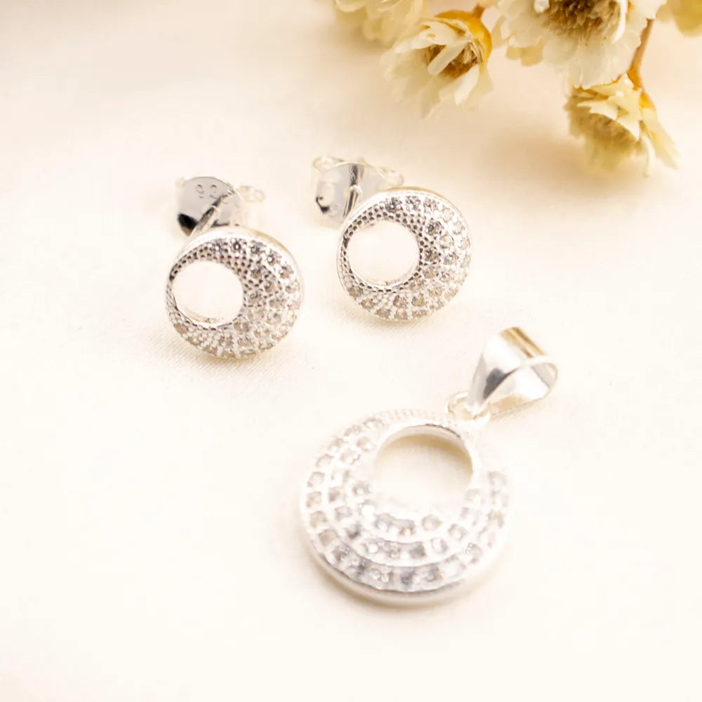Juego de aretes y dije de plata