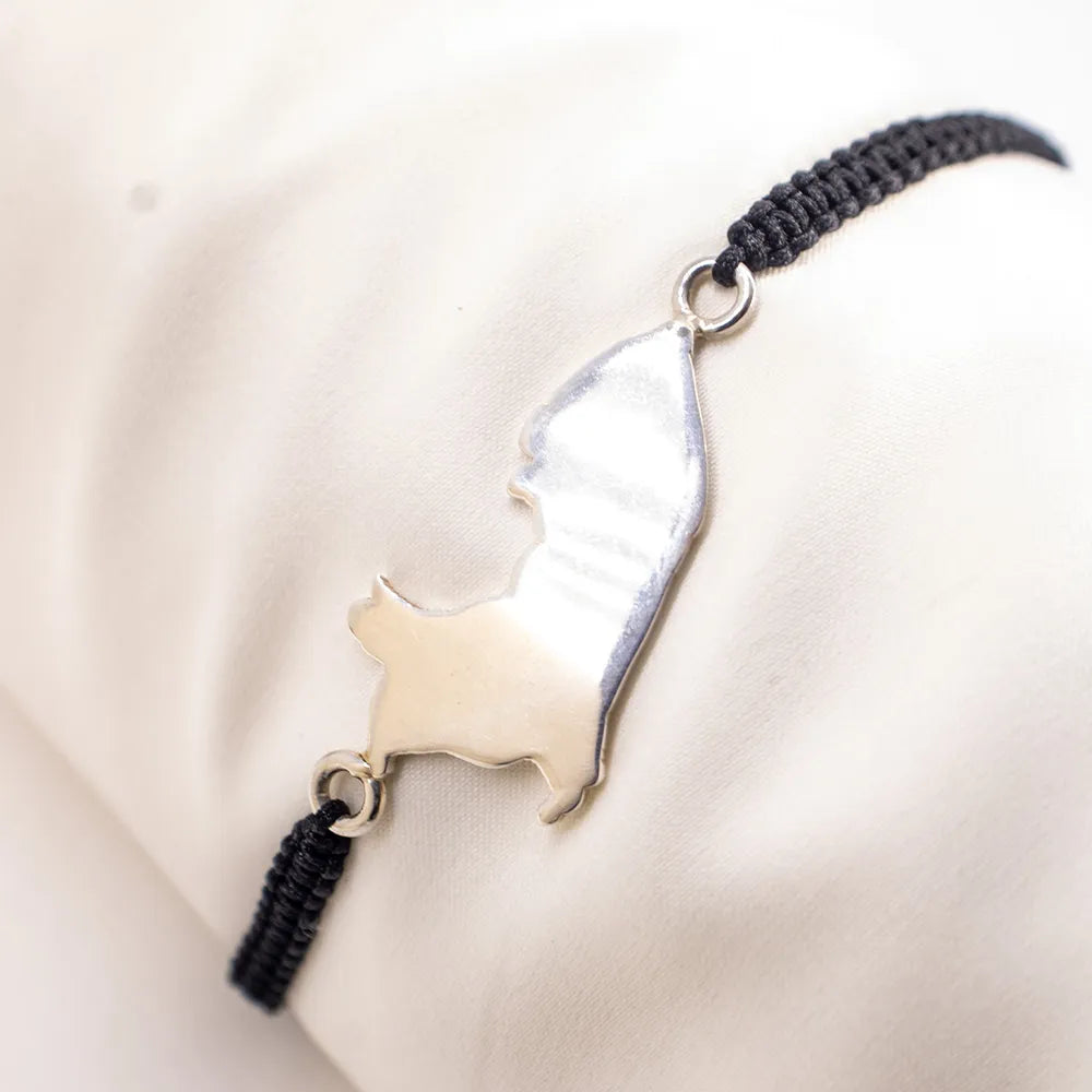 Pulsera tejida con dije Perú de plata
