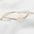 PULSERA GRADUABLE TEJIDA CON DIJE DE ORO 18K